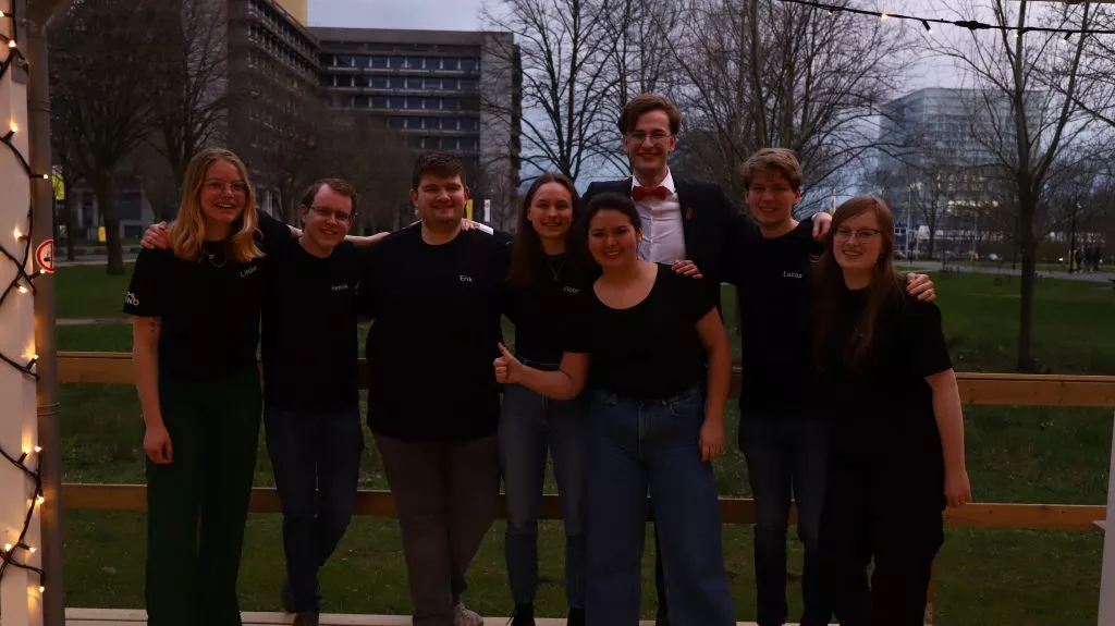 Eight Amino members posing together as a group