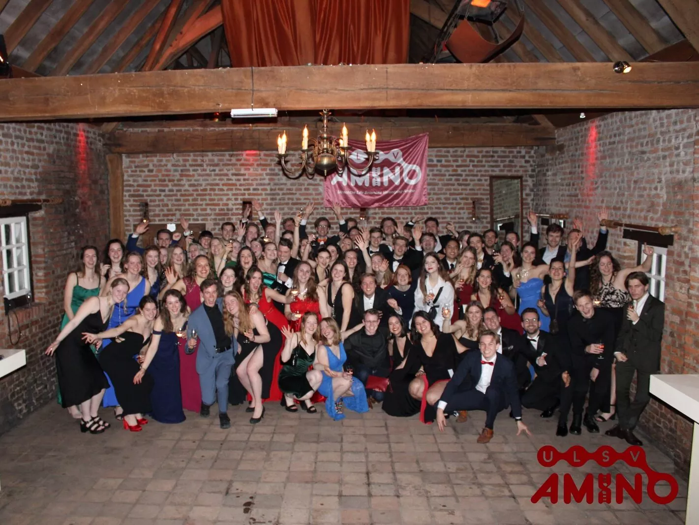 A large group of Amino members dressed festively for a gala