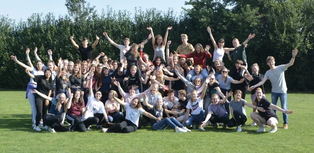A large group of Amino members posing together