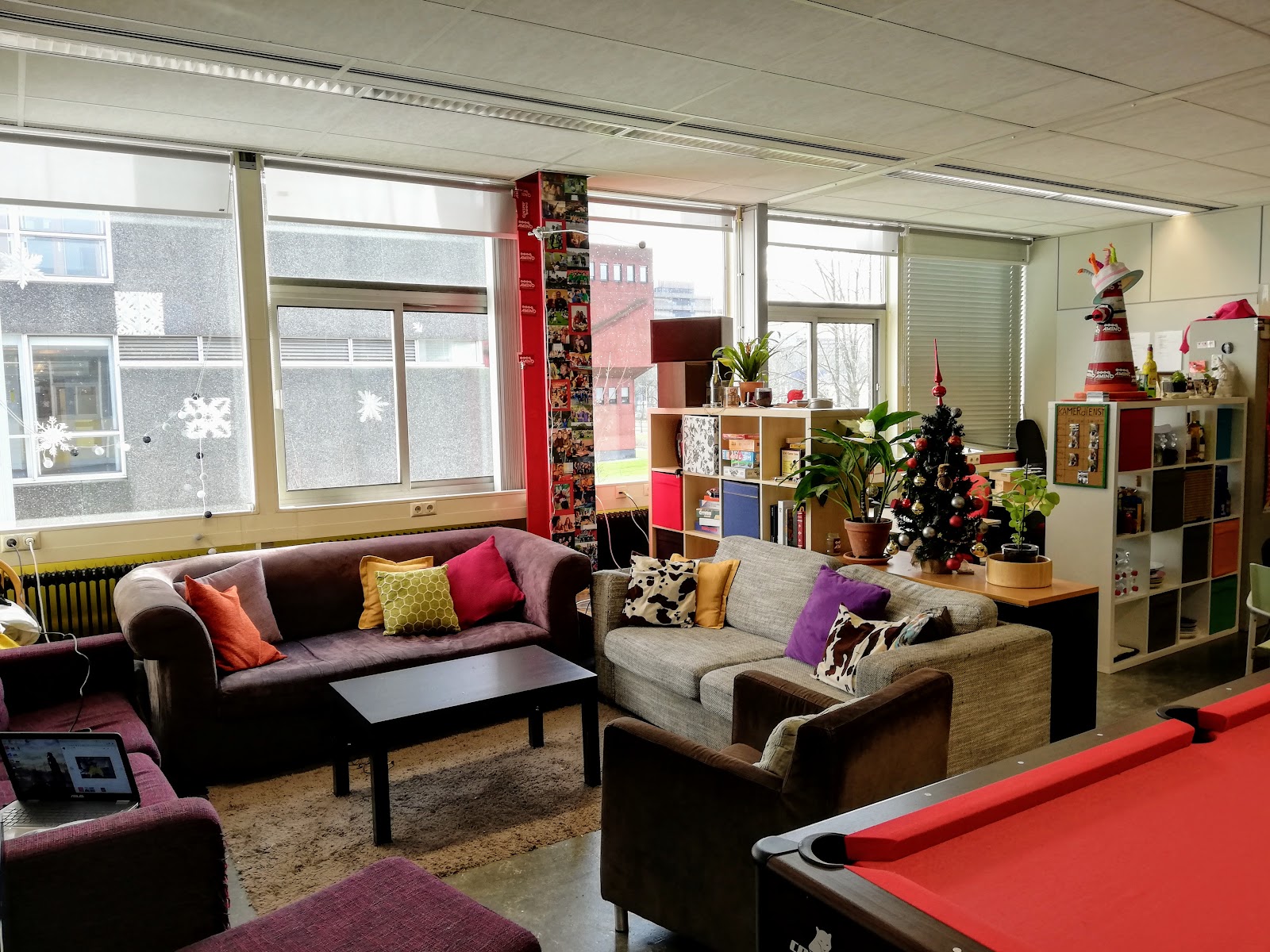 The Amino Room with members on the couches by the daylight windows